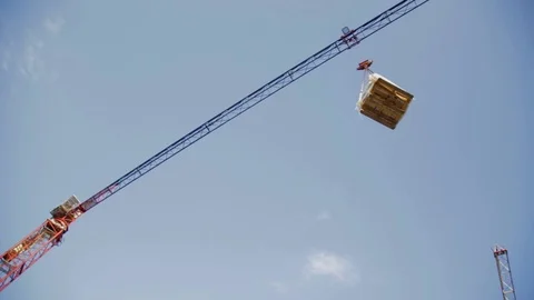 The building crane lifts the load, bottom view Stock Footage 101631777