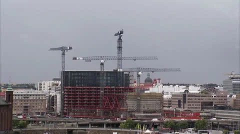 Building cranes by buildings under construction, Stockholm Video stock 11215099