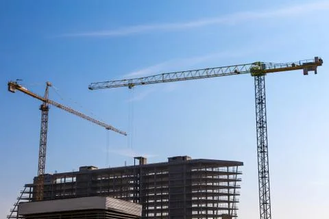 Building cranes on construction Stock Photos