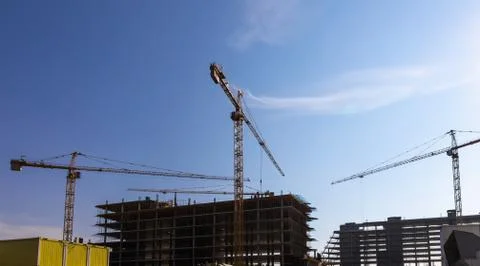 Building cranes on construction Stock Photos