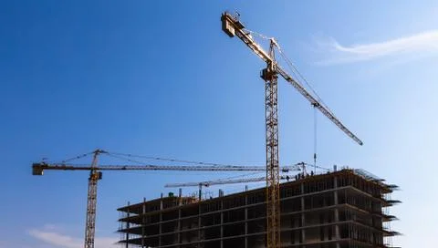 Building cranes on construction Stock Photos