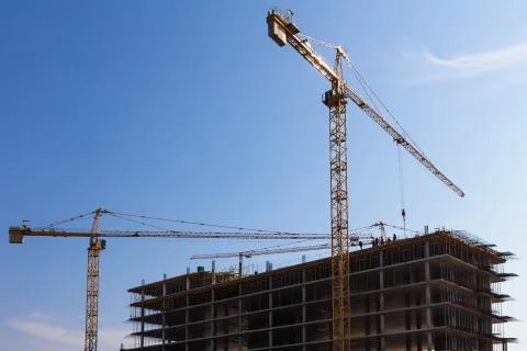 Building cranes on construction Stock-Fotos