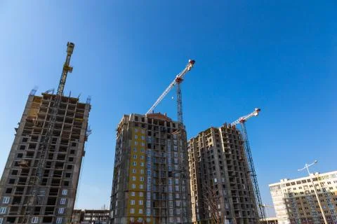 Building cranes on construction Stock Photos