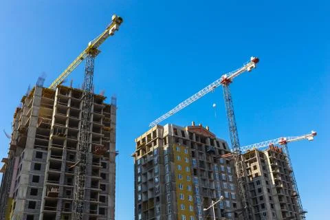 Building cranes on construction Stock Photos