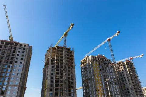 Building cranes on construction Stock Photos