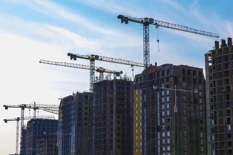 Building cranes on construction Stock Photos