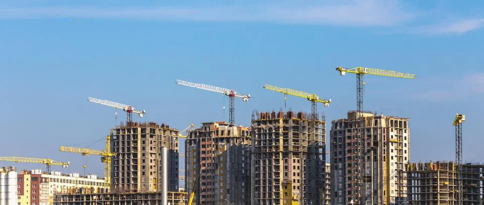 Building cranes on construction Stock Photos