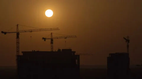 The building with cranes on a sundown background. time lapse Stock Footage 107103727