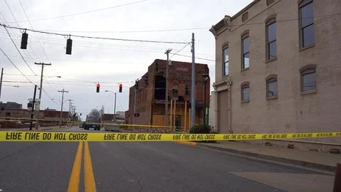 Building crumbles due to high winds in small town America Stock Footage 91996501