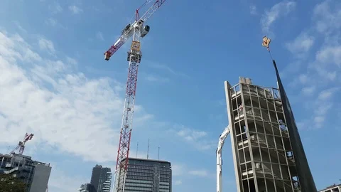 Building demolition with blue sky in the background - 4k footage Stock Footage 89110694