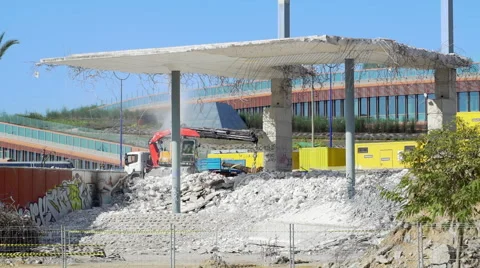 Building demolition with a hydraulic excavator Stock Footage