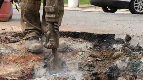 Building demolition jack hammer drill breaking concrete asphalt3 Stock Footage 119096967