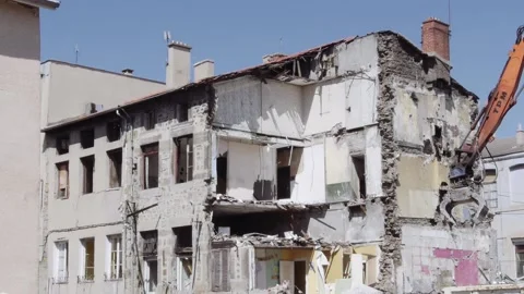 Building Demolition with Workers Walking in and Out Stock Footage 141386421