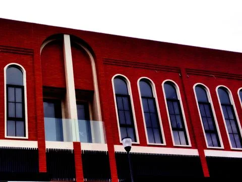 Building design with a classic  using an aesthetic red brick motif Stock Photos