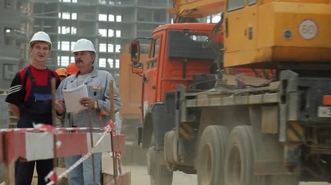 Building development. The engineers at the construction site. Dolly shot Stock Footage 45595684