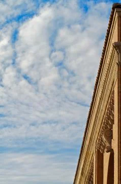 Building edge blue sky clouds Stock Photos