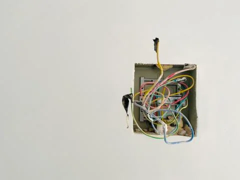 Building electrical system on cement wall Stock Photos