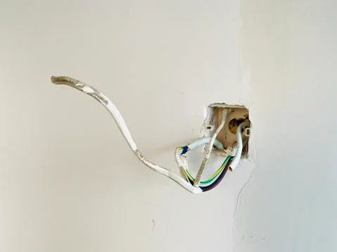 Building electrical system on cement wall Stock Photos