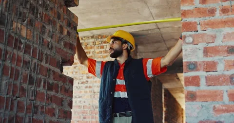 Building, engineer and tape measure at construction site for precision, Stock Footage 336793201