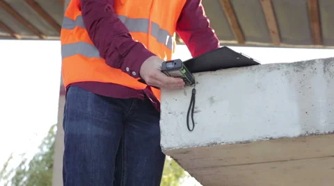 Building Engineer Does Measurements of the Building Stock Footage 67982961