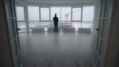 Building engineer or manager in real estate company enters the r 스톡 사진