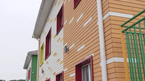 Building exterior with structured panels and modern frames Vídeo Stock 309785648