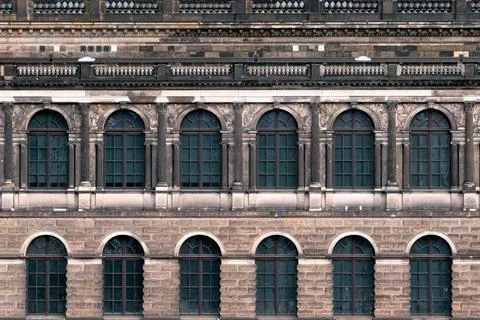 Building facade with arched windows. Stock Photos
