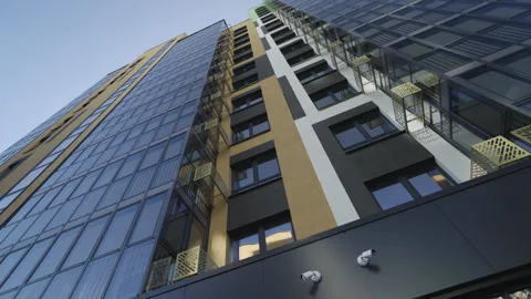 Building facade with bold black stripes and glass surfaces Vídeos de archivo 330519201