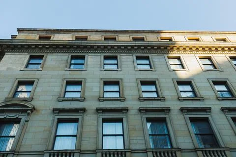 Building facade captured from below, showing windows and architectural deta.. Fotos Stock