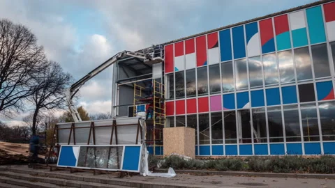 Building facade construction in the park Stock Footage 163355539