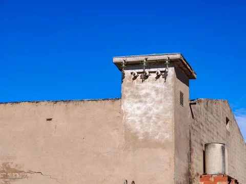 Building facade with electrical insulators under blue sky Stock-Fotos