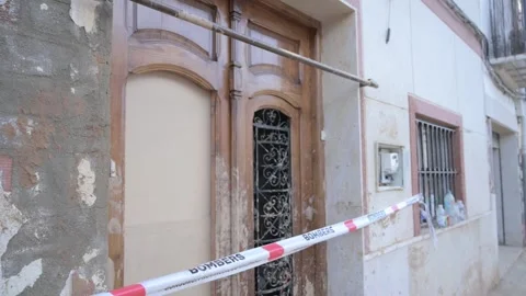 Building facade with firefighter caution tape after flooding in Chiva, Stock Footage 292248758