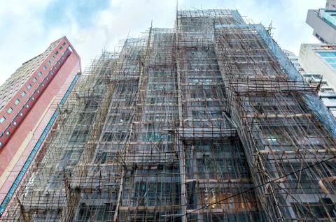 Building facade with scaffolding. Stock Photos