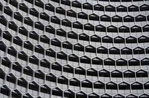 Building facades. Hexagons pattern. Architecture view Background. Stock Photos