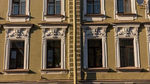 This is a building that features many windows throughout its structure Stock Photos