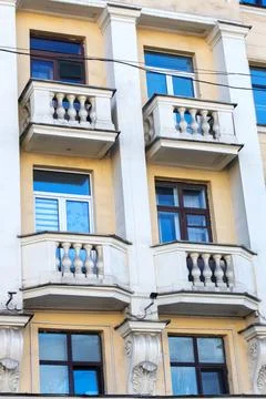 This is a building that features numerous windows and multiple balconies Stock Photos