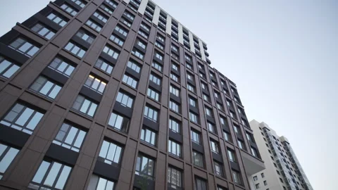 Building finished in dark tones creates bold silhouette Video stock 326484253