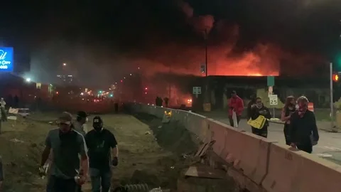 Building on fire during Minneapolis infamous worst USA riots in history Stock Footage 137553341