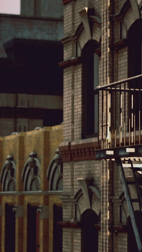 Building with fire escape in urban area at dusk near empty street Stock Footage 331687155