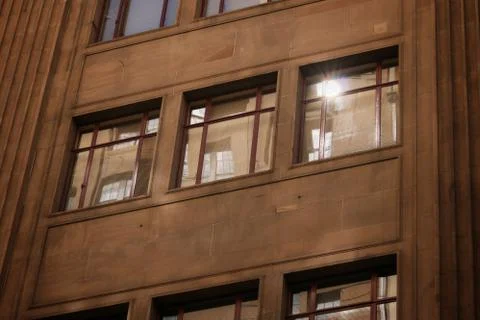 Building with flare light on the window Stock Photos