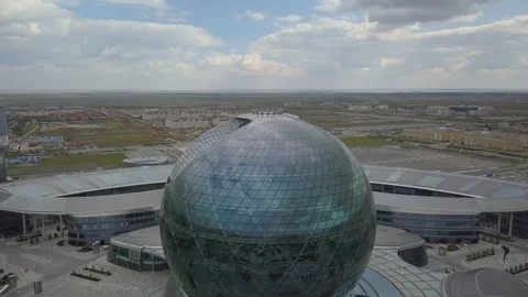 The building in the form of a ball on the background of the countryside Stock Footage 102386128