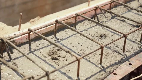 Building foundation concrete settling inside formwork Stock Footage 341294847