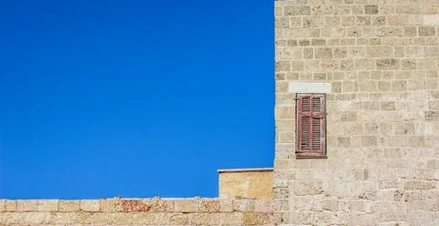 Building frame work pattern wallpaper concept sand stone brick wall blue sky  Stock Photos