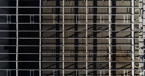 Building frames. The drone removes the concrete partitions of the building from Stock Footage 128188097