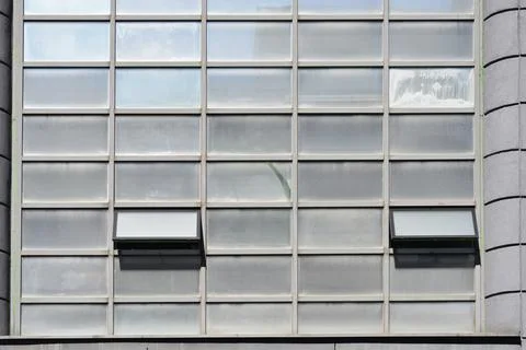 Building glass facade with open windows Stock Photos