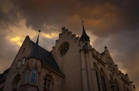 Building Gothic style with dark clouds hanging. Old gothic building with d... Fotos de archivo