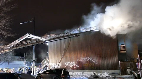 Building with graffiti on fire Stock Footage 105292996