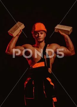 Building up great things. Construction worker or builder at work at building Stock Photos
