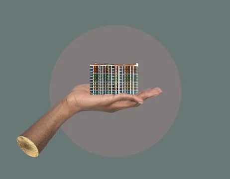 Building in hand development idea. African male holding modern high rise Foto stock