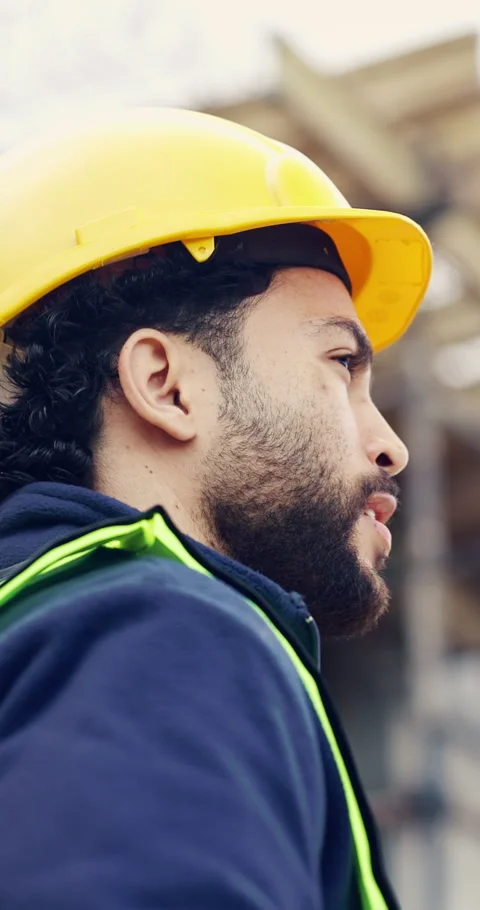Building, hard hat and thinking with man on construction site for engineering or Stock Footage 336802322